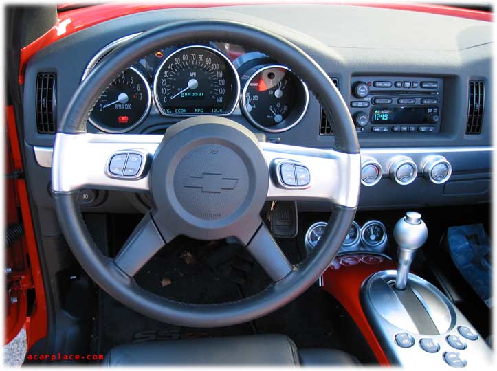 inside the Chevrolet SSR car reviews. Control buttons for the windows, top, 